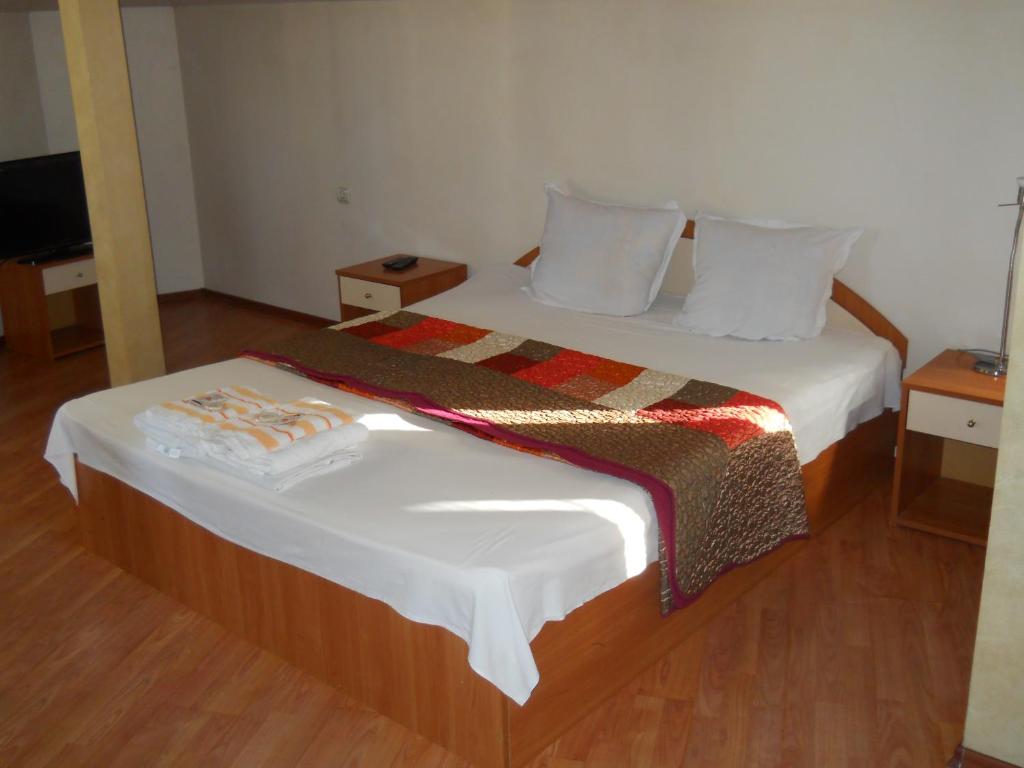 Postel nebo postele na pokoji v ubytování Hotel Orient
