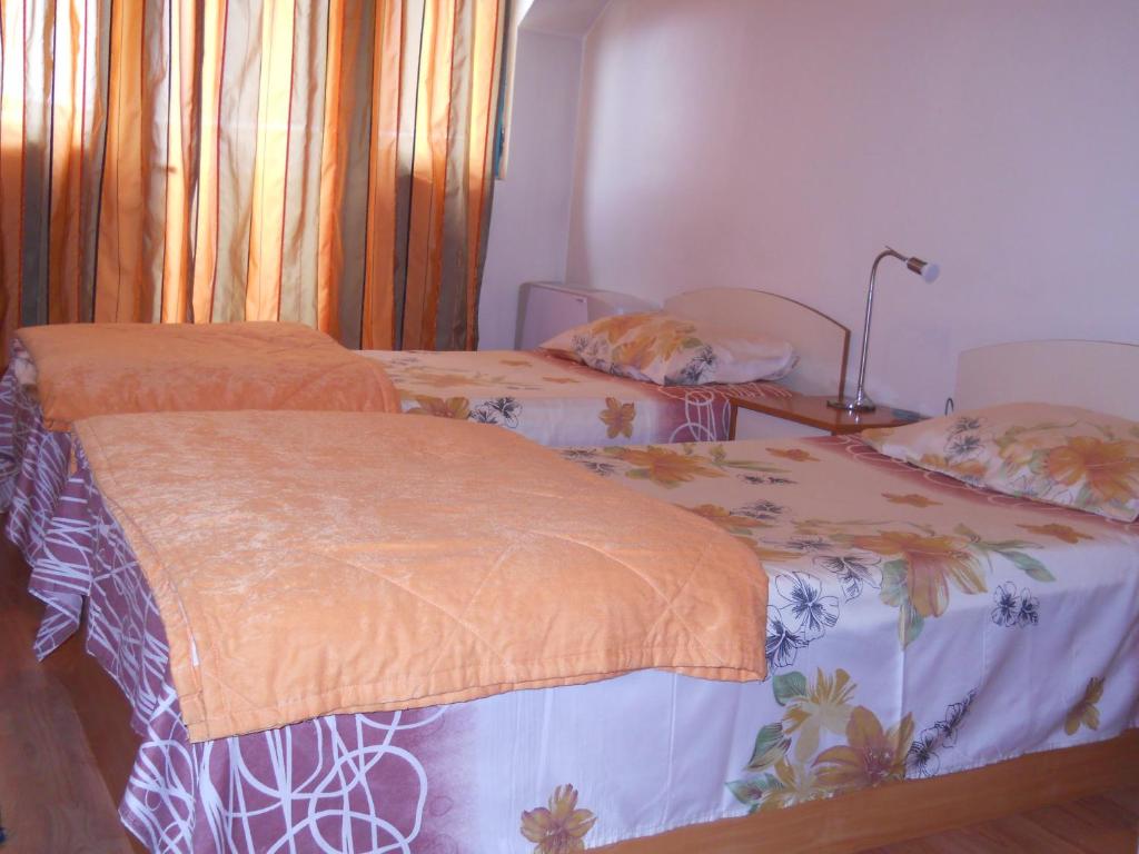 Postel nebo postele na pokoji v ubytování Hotel Orient