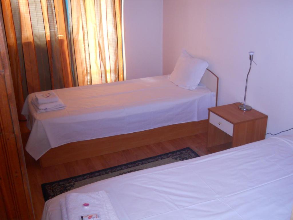 Postel nebo postele na pokoji v ubytování Hotel Orient