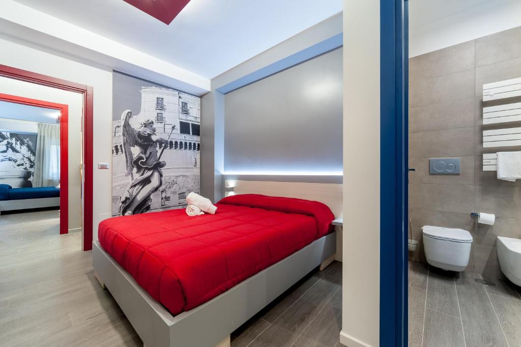 ローマにあるイル ロッソ エ リ ブルのベッドルーム1室(赤いベッド1台付)、バスルーム1室が備わります。
