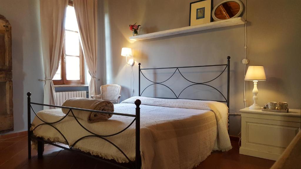 Postel nebo postele na pokoji v ubytování Le Quattro Stagioni B&B and Apartament