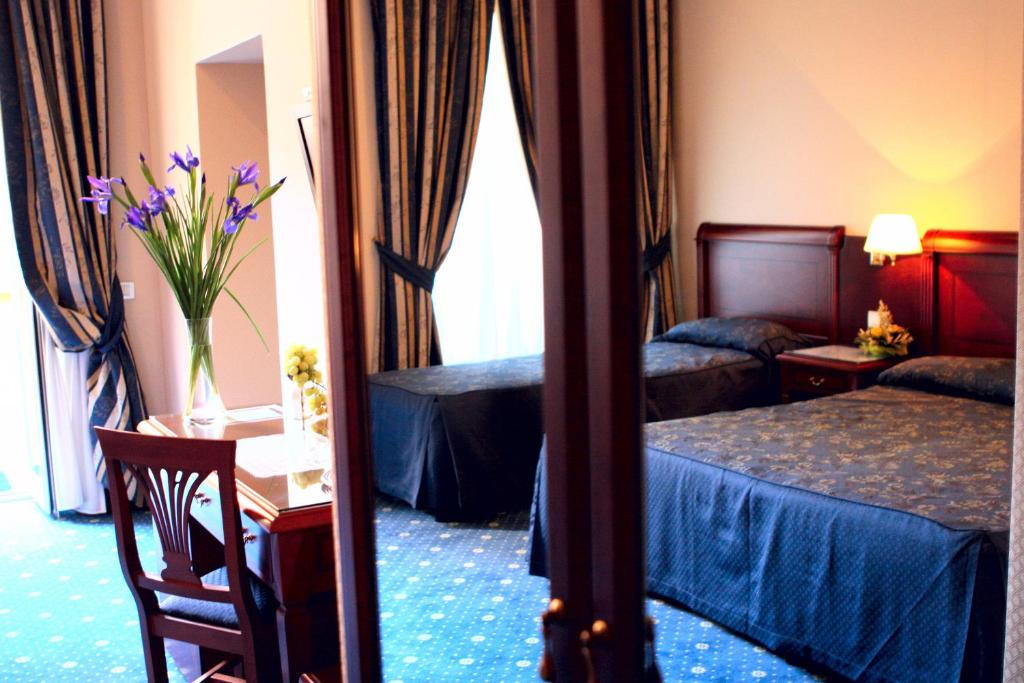 Postel nebo postele na pokoji v ubytování Hotel Artorius