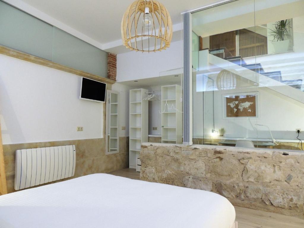 Posteľ alebo postele v izbe v ubytovaní Apartamento Ribera Del Puente