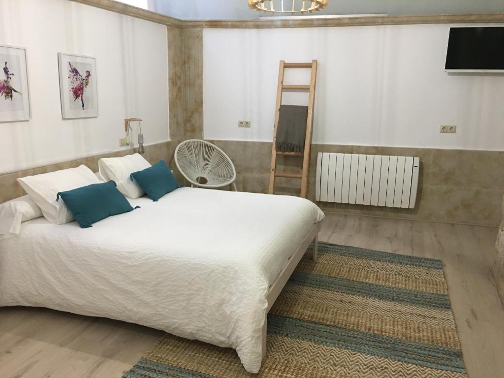 Posteľ alebo postele v izbe v ubytovaní Apartamento Ribera Del Puente