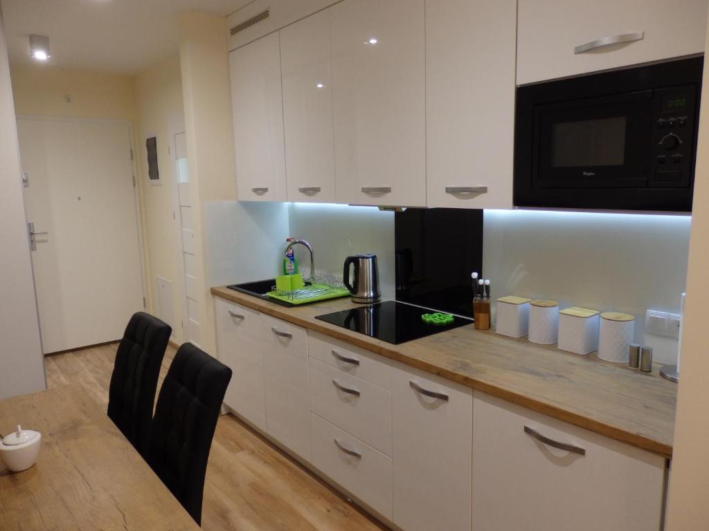 Kuchyň nebo kuchyňský kout v ubytování Apartament Widokowy Wisła