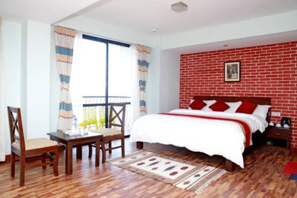 Postel nebo postele na pokoji v ubytování Hotel Himalayan Villa