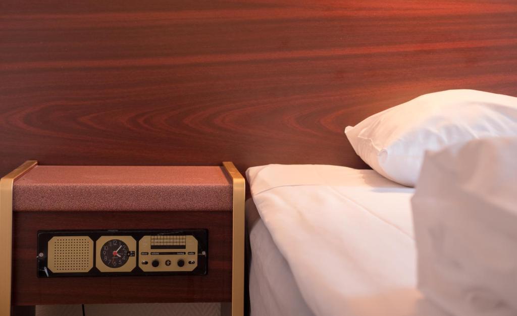 Postel nebo postele na pokoji v ubytování Hotel Åberg Centralhotellet