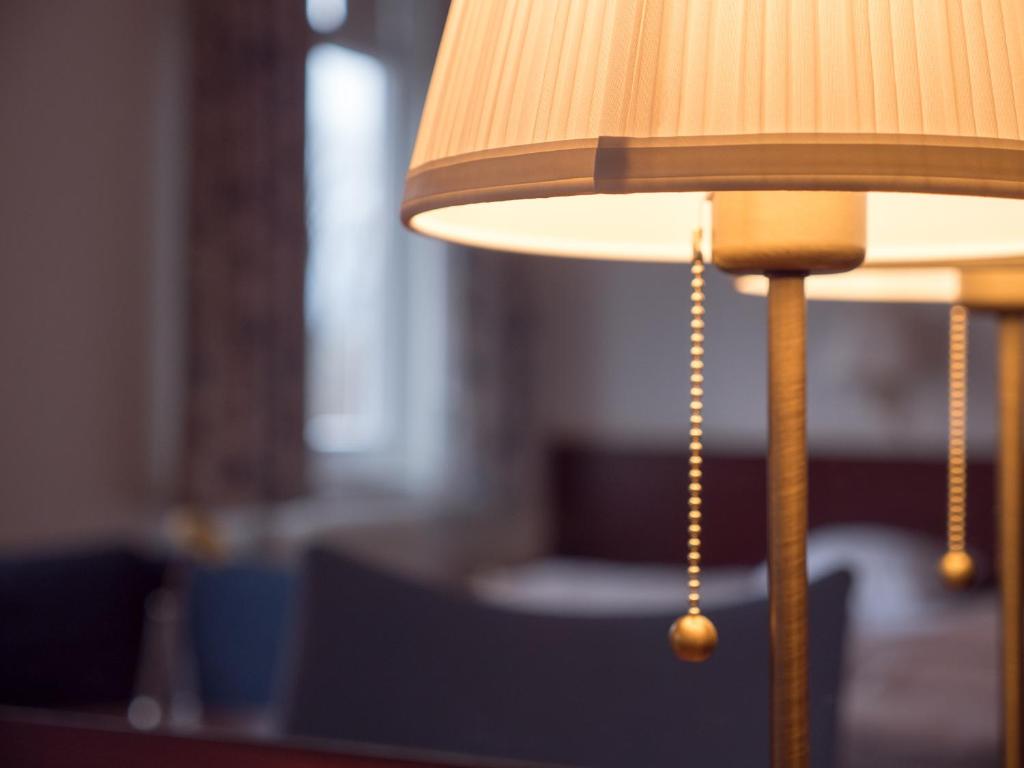 Postel nebo postele na pokoji v ubytování Hotel Åberg Centralhotellet