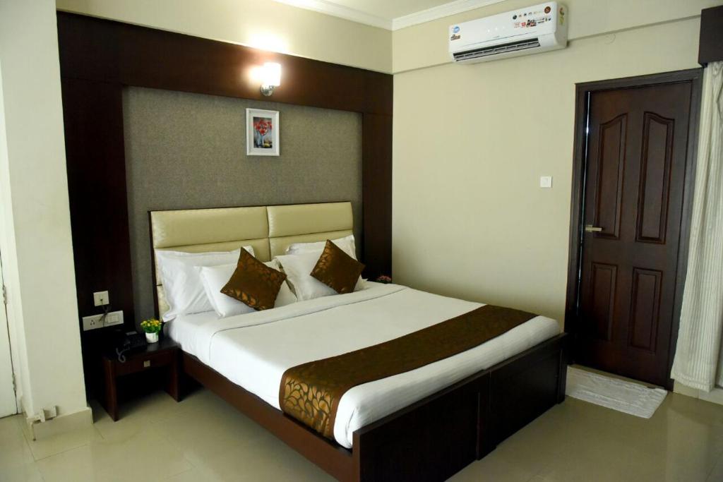 Postel nebo postele na pokoji v ubytování Hotel Pearl International