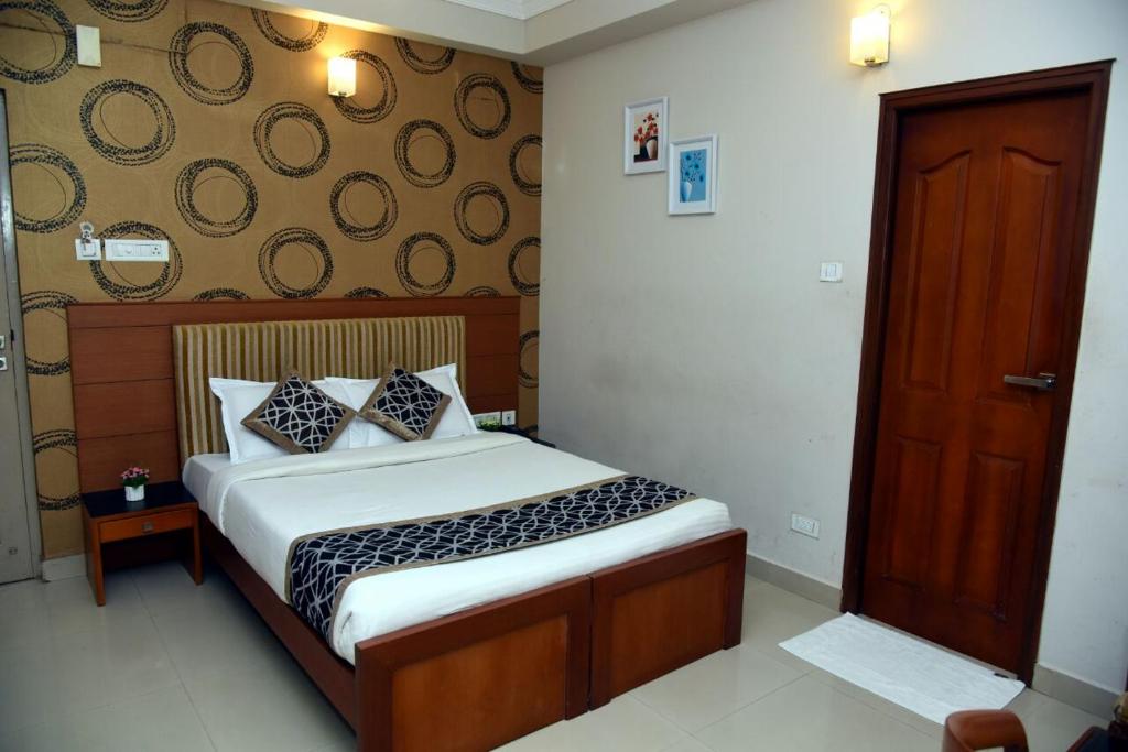 Postel nebo postele na pokoji v ubytování Hotel Pearl International