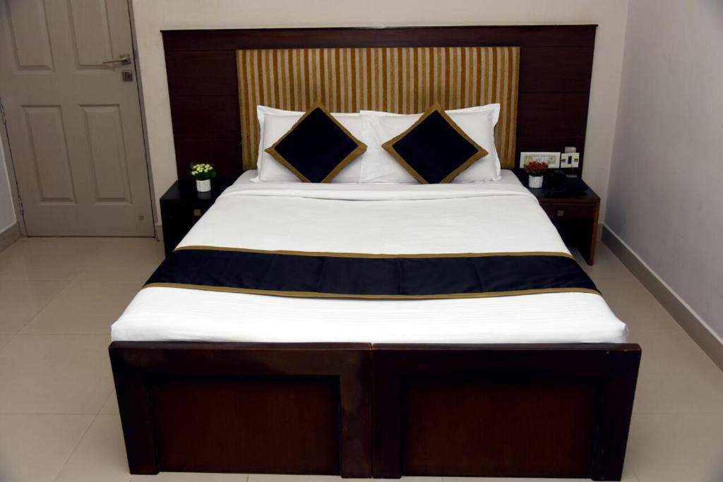 Postel nebo postele na pokoji v ubytování Hotel Pearl International