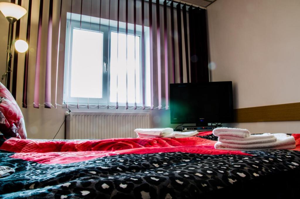 Postel nebo postele na pokoji v ubytování Pensiunea Georgibel