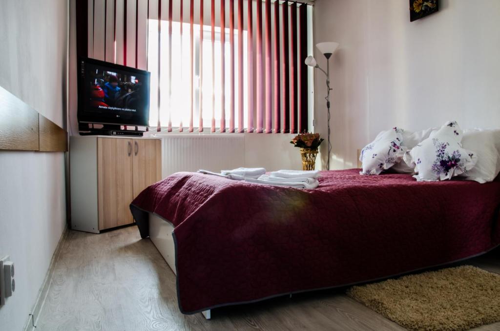 Postel nebo postele na pokoji v ubytování Pensiunea Georgibel