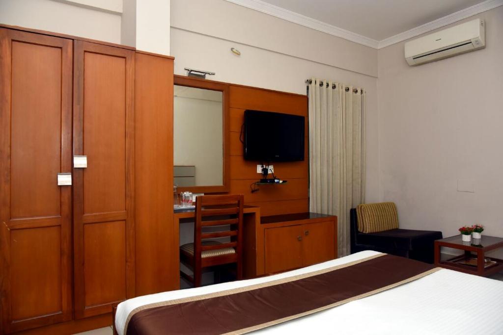 TV a/nebo společenská místnost v ubytování Hotel Pearl International