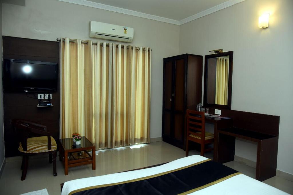 Postel nebo postele na pokoji v ubytování Hotel Pearl International