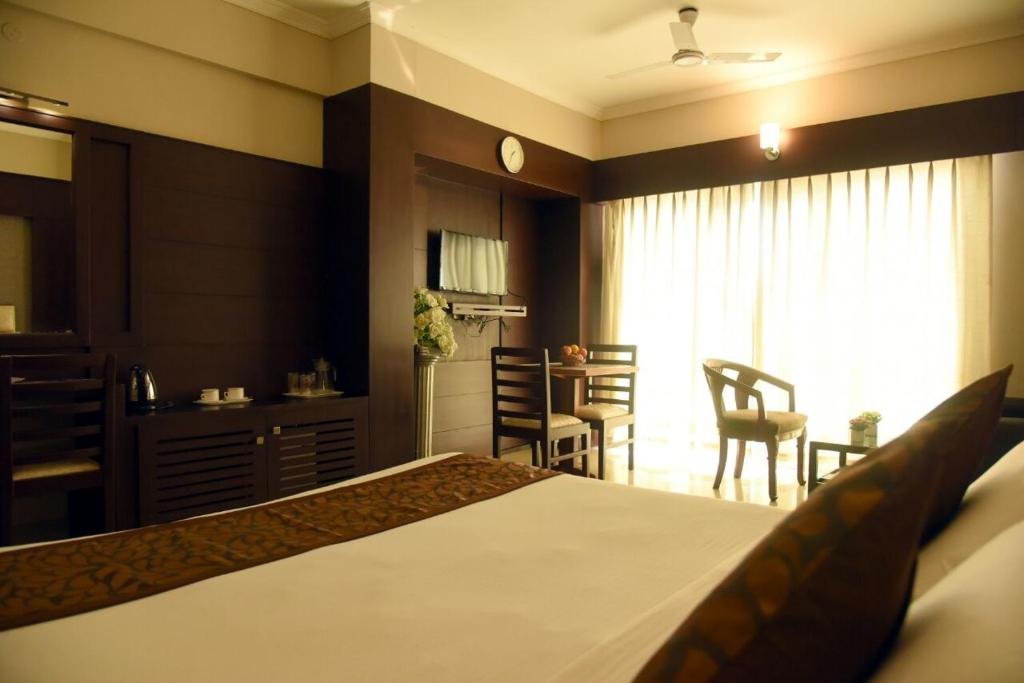 Postel nebo postele na pokoji v ubytování Hotel Pearl International