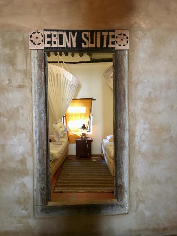Postel nebo postele na pokoji v ubytování Firefly Boutique Lodge