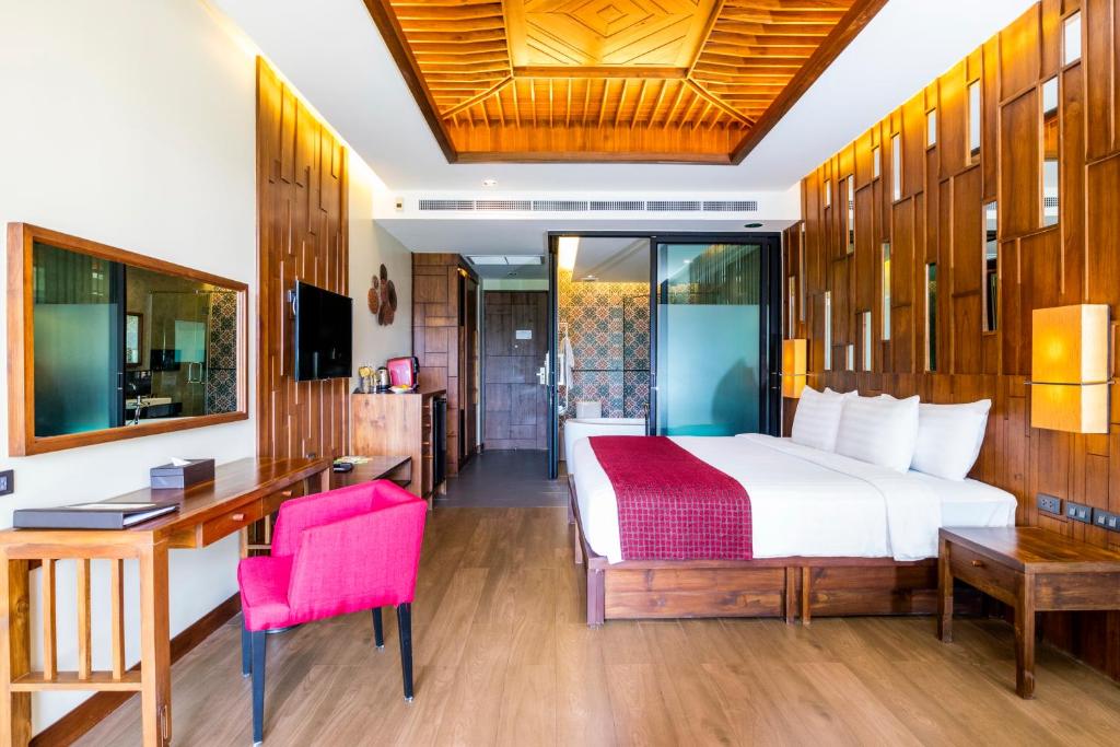 Postel nebo postele na pokoji v ubytování Aonang Phu Pi Maan Resort & Spa