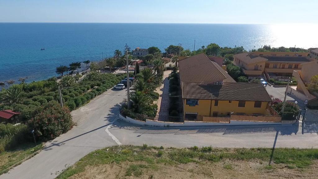 an aerial view of a house with the ocean at Fronte Mare Capo San Marco in Sciacca