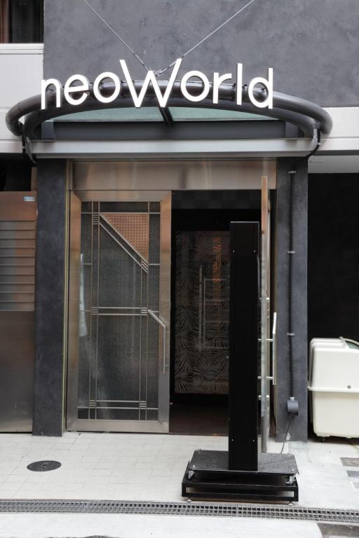 a store with a sign on the front of a building at Hotel Neo World in Osaka