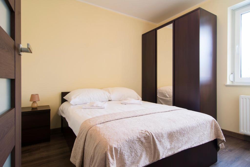 Posteľ alebo postele v izbe v ubytovaní Apartamenty Sun & Snow Ustroń Przy Rynku