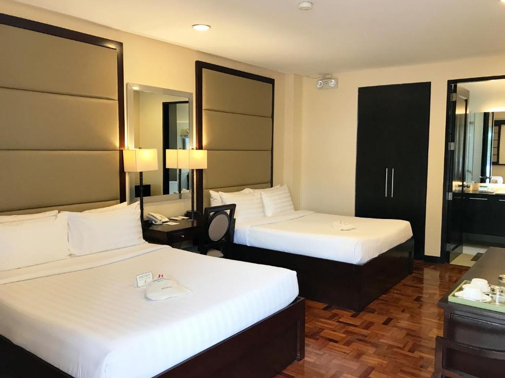 Postel nebo postele na pokoji v ubytování Jinjiang Inn - Boracay Station 1