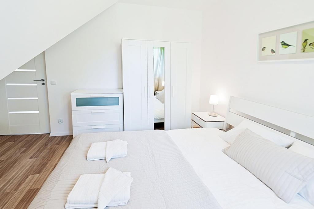 Posteľ alebo postele v izbe v ubytovaní Apartamenty Sun & Snow Lipki Park Zakopane