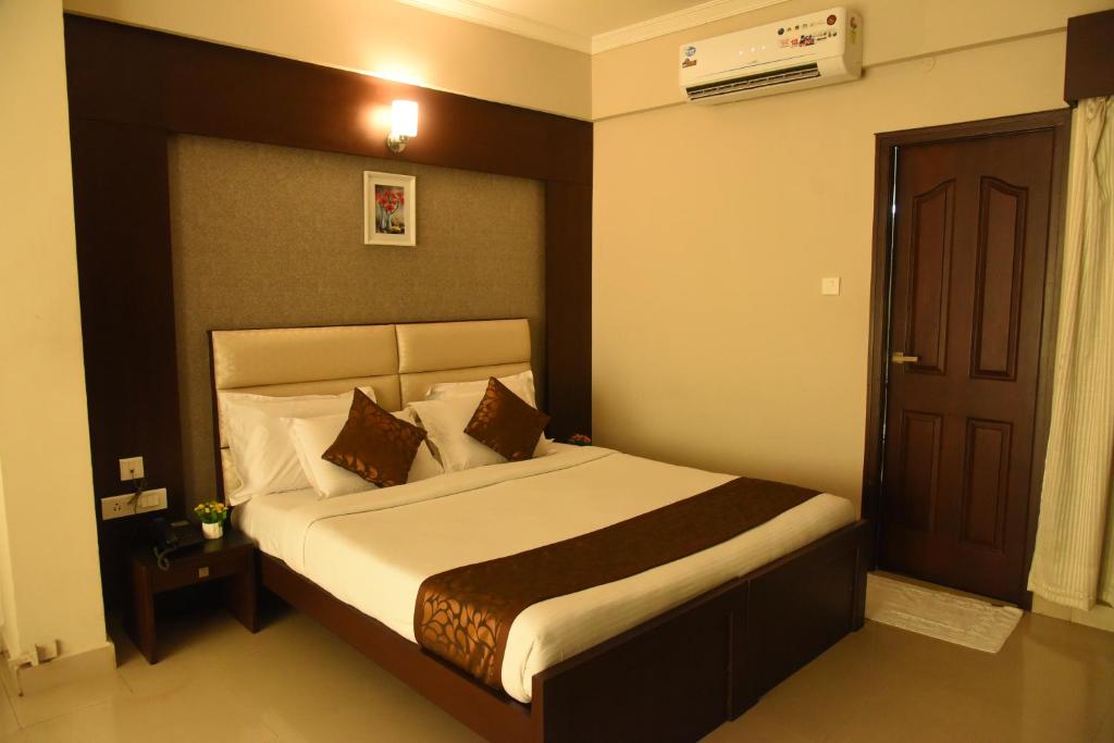 Postel nebo postele na pokoji v ubytování Hotel Pearl International