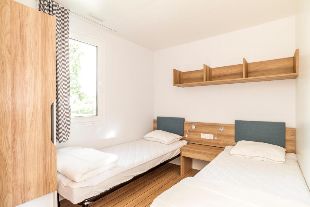 Postel nebo postele na pokoji v ubytování First Camp Glyttinge-Linköping
