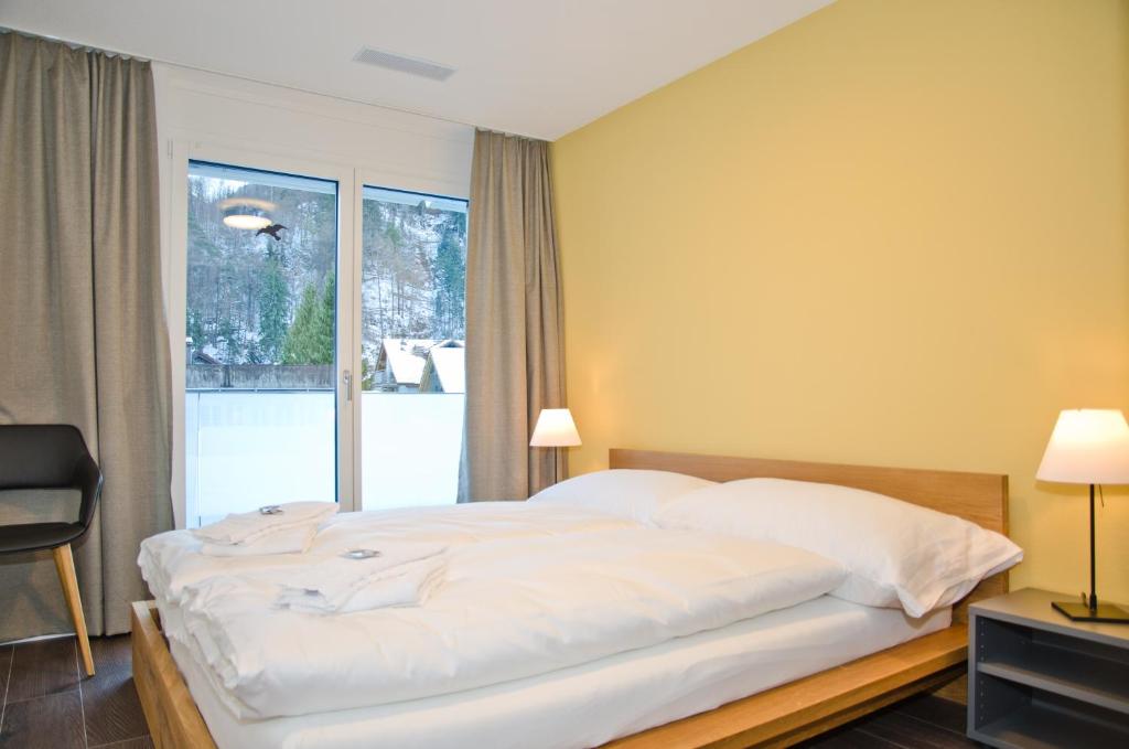 Postel nebo postele na pokoji v ubytování Apartment Ankebälleli - GRIWA RENT AG