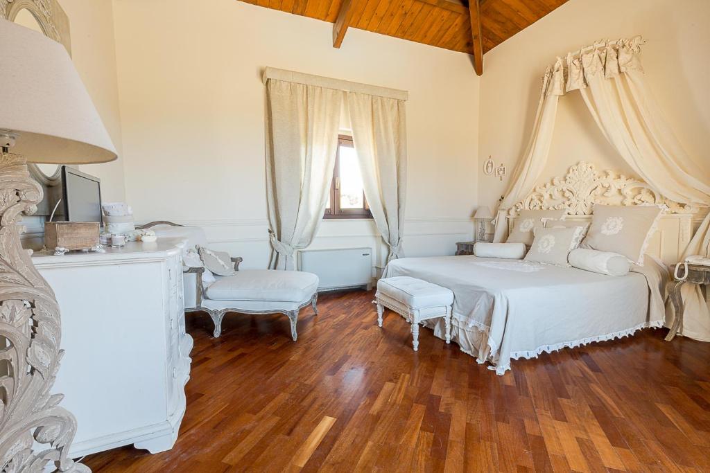 Postel nebo postele na pokoji v ubytování Hotel Villa Calandrino