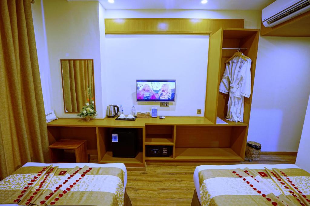 Postel nebo postele na pokoji v ubytování The Hotel Nova