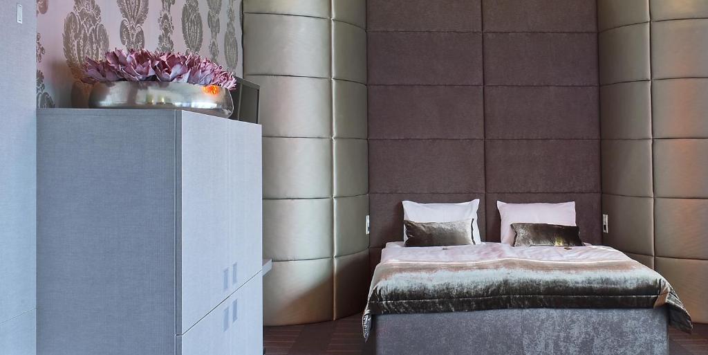 Postel nebo postele na pokoji v ubytování G Design Hotel