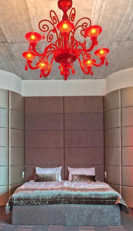 Postel nebo postele na pokoji v ubytování G Design Hotel
