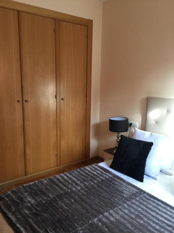 Posteľ alebo postele v izbe v ubytovaní Apartamento Conde Luna
