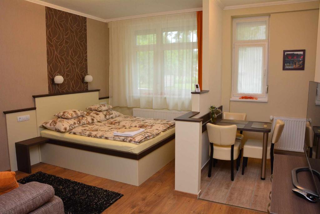 Postel nebo postele na pokoji v ubytování Bodza Apartmanok