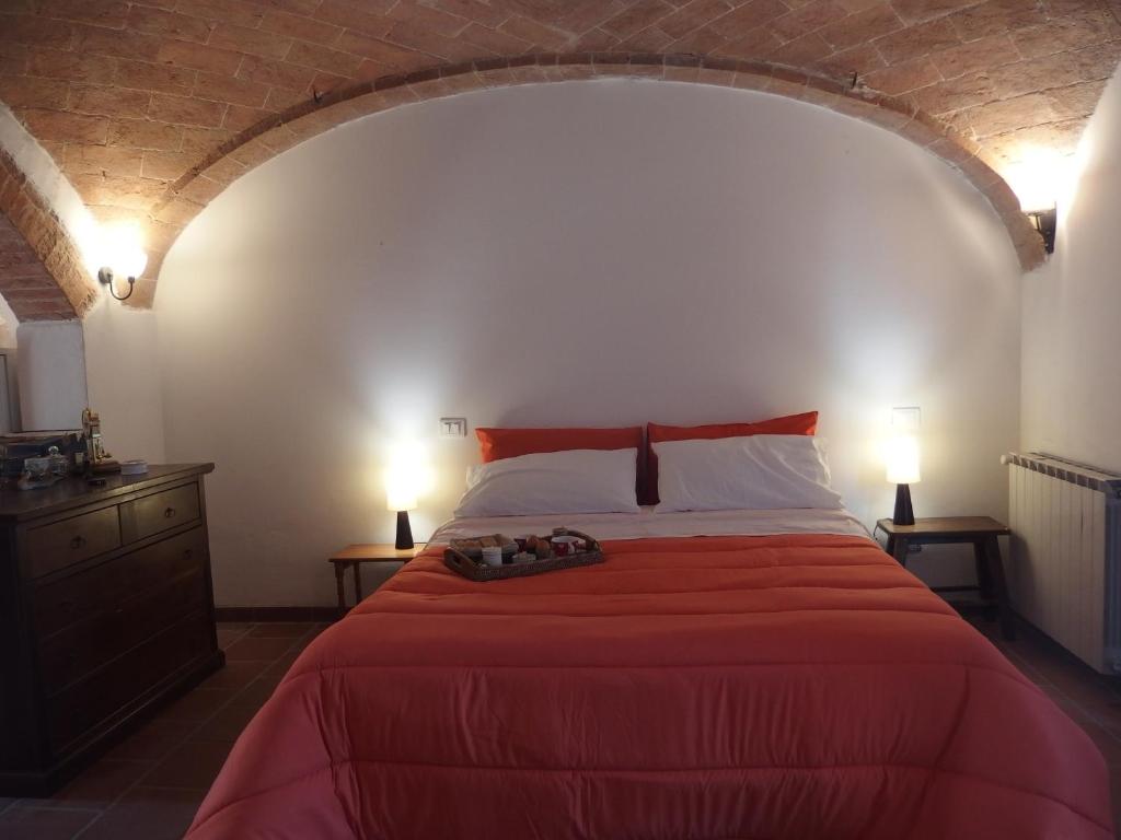 Postel nebo postele na pokoji v ubytování Podere Alberello