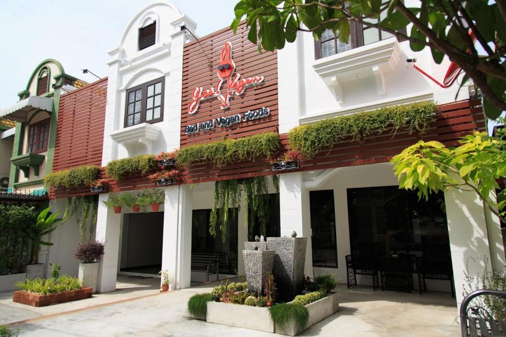 a building with a sign on the front of it at T2 Hostel Thappraya 12 in Pattaya South