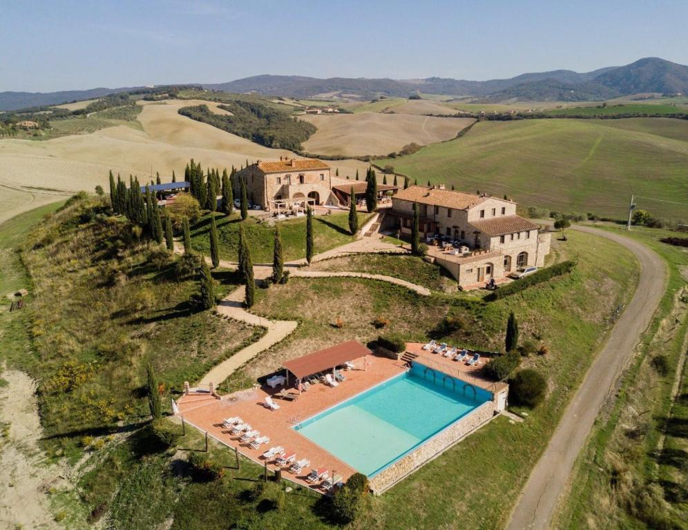 an aerial view of a large estate with a swimming pool at Agrihotel Il Palagetto in Volterra