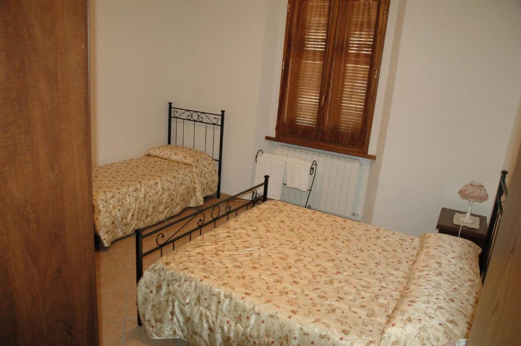 Letto o letti in una camera di Affittacamere La Sosta