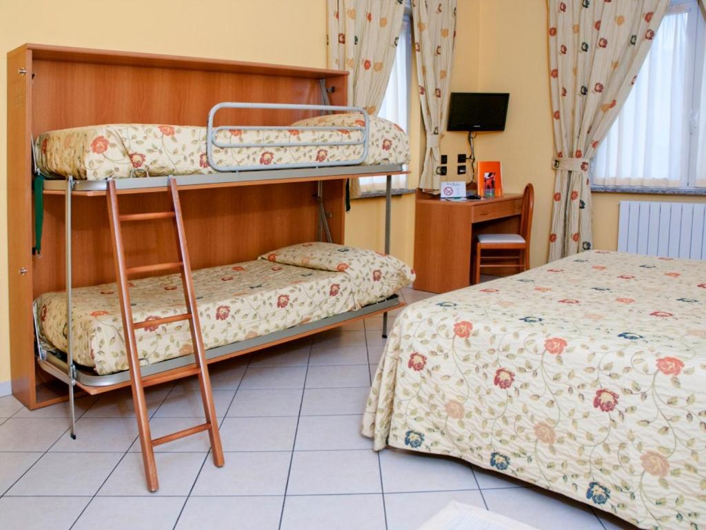 Postel nebo postele na pokoji v ubytování Hotel Agata