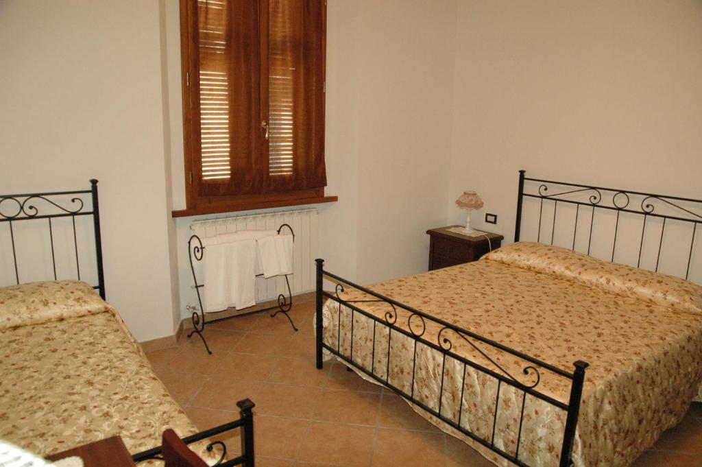 Letto o letti in una camera di Affittacamere La Sosta