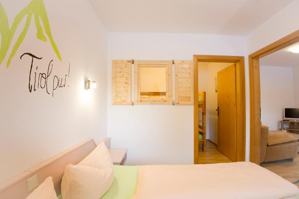 Postel nebo postele na pokoji v ubytování Aparthotel Hummerau