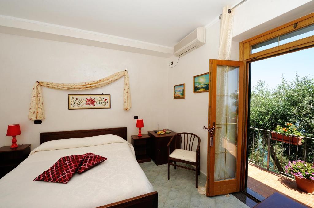 A bed or beds in a room at H.H.Le Palme