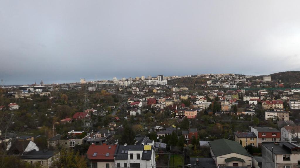 a view of a city with houses and buildings at Hausik with the view in Gdynia