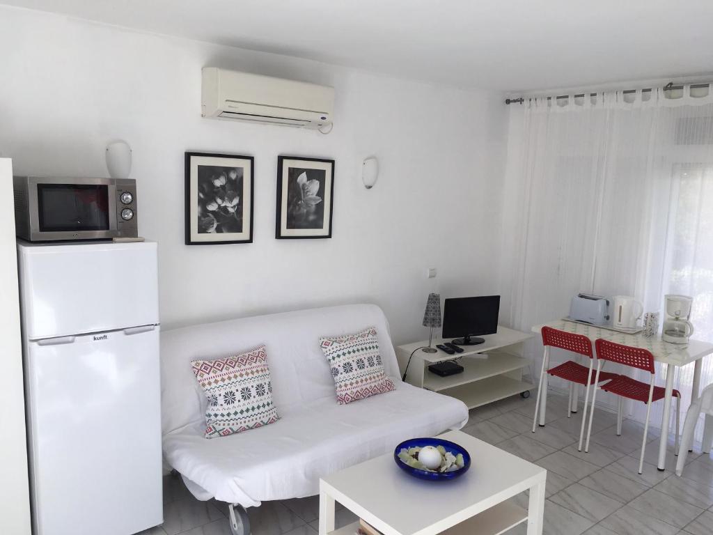 Telewizja i/lub zestaw kina domowego w obiekcie Bungalow Aloha Torres