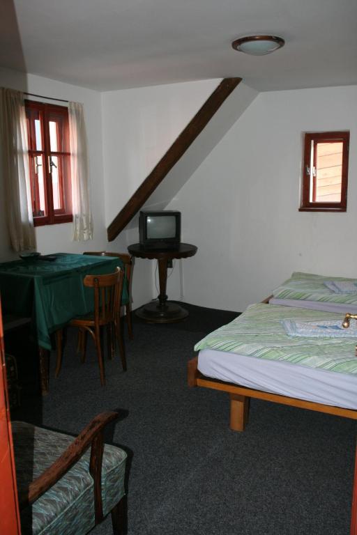 Postel nebo postele na pokoji v ubytování Penzion Novopacké Sklepy