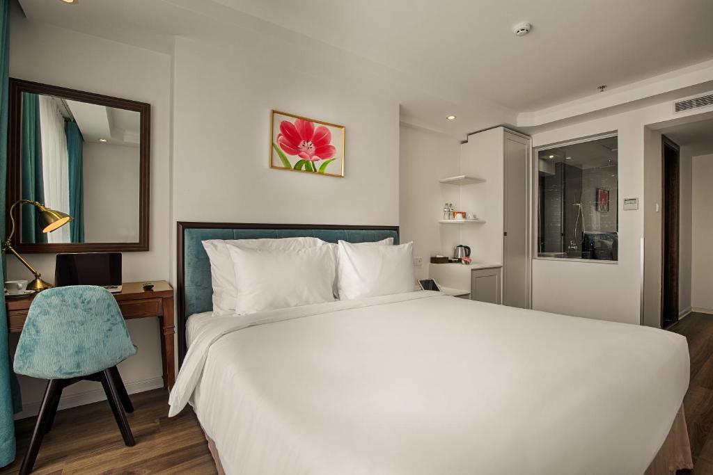 Postel nebo postele na pokoji v ubytování Adaline Hotel and Suite