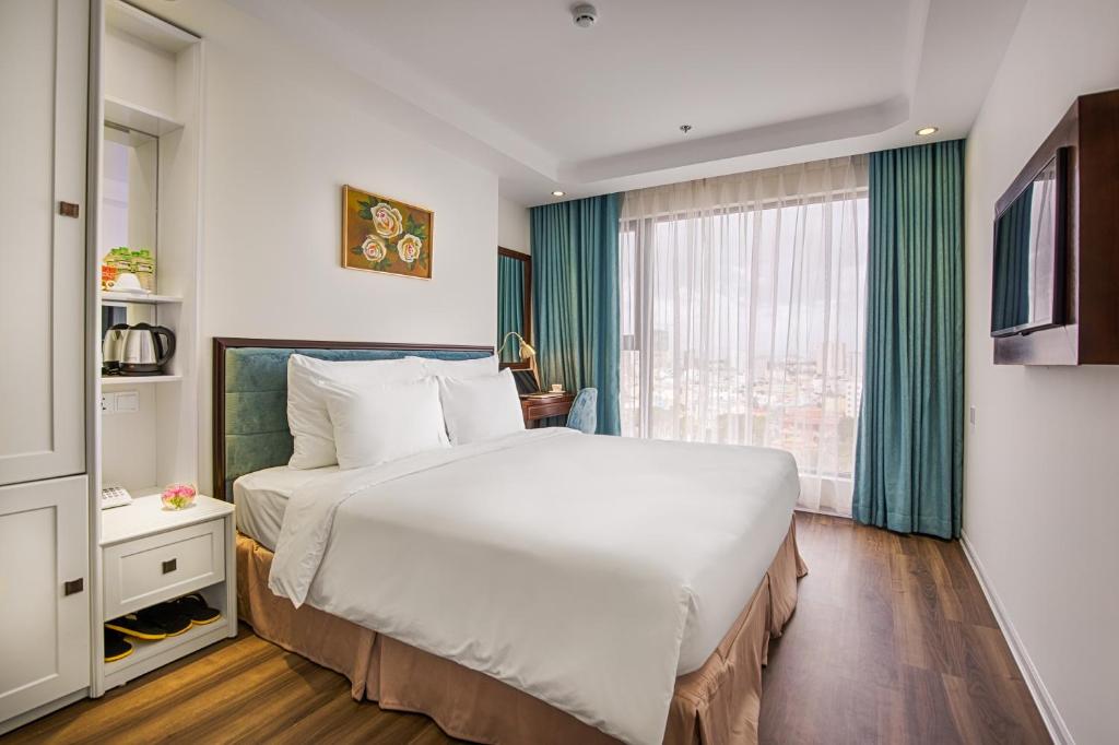 Postel nebo postele na pokoji v ubytování Adaline Hotel and Suite
