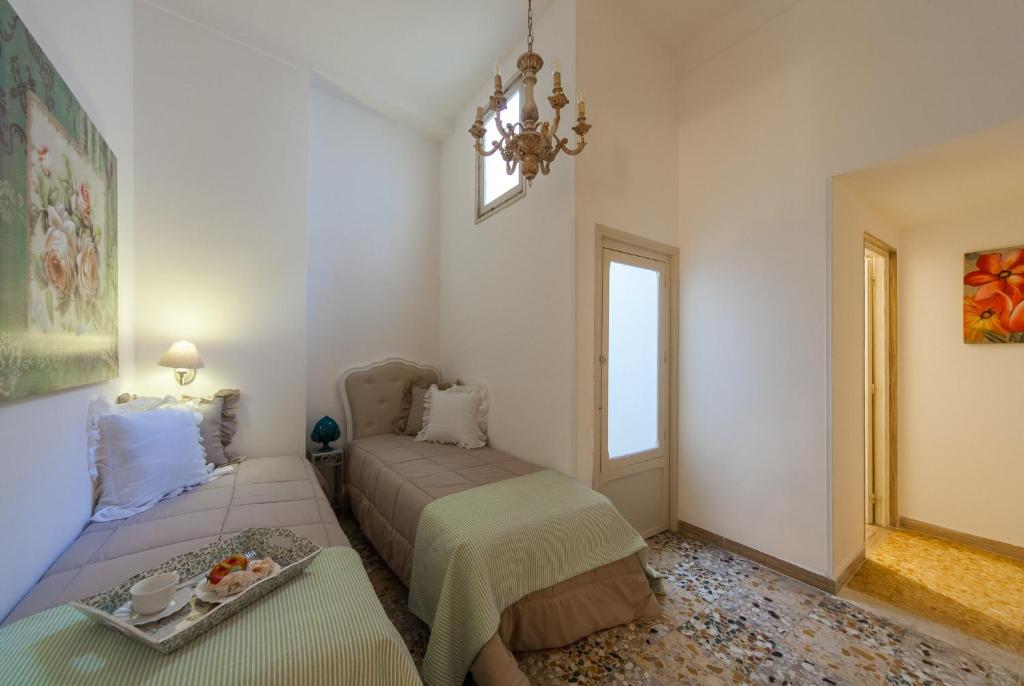 Postel nebo postele na pokoji v ubytování palazzinApulia